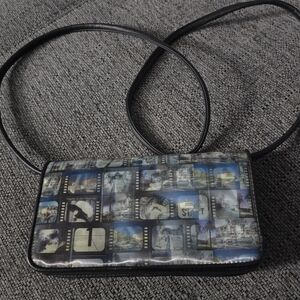 Fossil Relic crossbody holographic california/hollywood purse. New without tags.